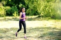 Attractive running young woman outdoor. Workout in the park, forest, nature. Royalty Free Stock Photo