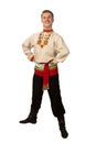 Attractive russian guy dancing in folk costume isolated on white