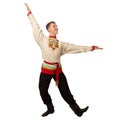 Attractive russian guy dancing in folk costume isolated on white