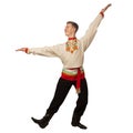 Attractive russian guy dancing in folk costume isolated on white