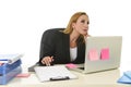 Attractive 40s blond businesswoman working at office laptop computer Royalty Free Stock Photo