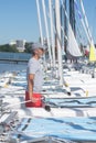 Attractive sailor rigging hobbie-cat before sailing course