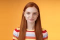 Attractive self-assured redhead girl encouraging herself look mirror confident prepare interview speech standing orange