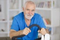 Attractive senior man at health club exercising on stepper Royalty Free Stock Photo
