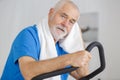 attractive senior man at health club exercising on stepper Royalty Free Stock Photo