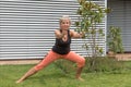 Attractive senior woman with her forearms doing her stretches