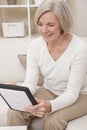Attractive Senior Woman Using a Tablet Computer Royalty Free Stock Photo