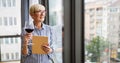 Attractive senior woman using a tablet computer relaxing at home Royalty Free Stock Photo