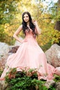 Attractive sensual woman in pink dress. Autumn, fall Royalty Free Stock Photo