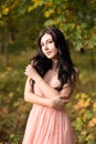 Attractive sensual woman in pink dress. Autumn, fall Royalty Free Stock Photo