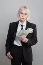 Attractive serious successful businesswoman holding money cash US Dollar and Euro banknote. Win-win, deal, salary and credit Royalty Free Stock Photo