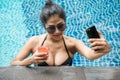 Sexy Asian girl selfie at swimming pool Royalty Free Stock Photo