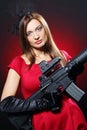 Attractive and spy woman with assault rifle Royalty Free Stock Photo