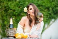 Attractive sexy woman drinking wine outdoors. Beautiful female having a glass of wine. Young beautiful model on vacation Royalty Free Stock Photo