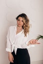 Attractive sexy woman wear business look. Women look sexy and sensual. model wear white shirt and black pants.