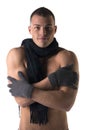 Attractive shirtless young man with wool winter gloves and scarf