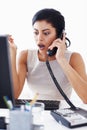 Shocked customer service representative. Attractive shocked female call centre operator. Royalty Free Stock Photo