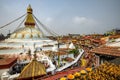 Attractive shot of Boudhanath Stupa temple dome worshipers lighted candles prayer flags Nepal