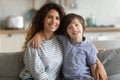 Attractive single mother posing for family photo with son. Royalty Free Stock Photo