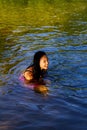 Young Japanese American Woman Sitting In River In Dress Royalty Free Stock Photo