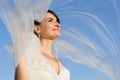 Attractive Smiling Bride with Flying Veil