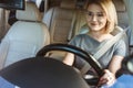 attractive smiling businesswoman driving