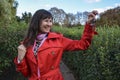 Attractive smiling delighted woman with raise fists holding up a set of keys belonging to her house or car Royalty Free Stock Photo