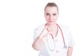 Attractive and smiling doctor showing peace sign or number two Royalty Free Stock Photo