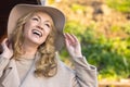 Attractive Smiling Middle Aged Woman Outside Wearing a Hat Royalty Free Stock Photo