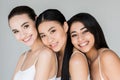 attractive smiling multiethnic women looking at camera