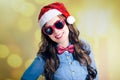 Attractive smiling teenage girl in Santa hat and Royalty Free Stock Photo