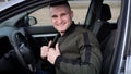 Attractive smiling young man in a car Royalty Free Stock Photo