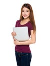 Attractive smiling young woman holding laptop computer Royalty Free Stock Photo