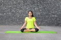 Attractive spiritual young woman doing yoga