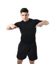 Attractive sport man pointing on his black t-shirt with copy space for adding gym fitness health club logo Royalty Free Stock Photo