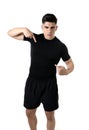 Attractive sport man pointing on his black t-shirt with copy space for adding gym fitness health club logo Royalty Free Stock Photo