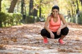 Attractive sport woman in runner sportswear taking a break tired smiling happy and cheerful after running workout