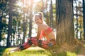 Attractive sportive woman wearing smart watch taking a break after workout session. Lifestyle image