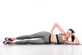 attractive sporty girl exercising on yoga mat and smiling at camera Royalty Free Stock Photo