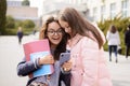 Students reading messege on phone near university Royalty Free Stock Photo