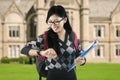 Attractive student looking at her watch Royalty Free Stock Photo