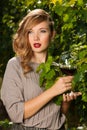 Attractive stylish woman drinking glass of red wine in vineyard Royalty Free Stock Photo