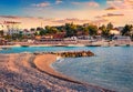 Attractive summer cityscape of Ksamil port. Spectacular evening seascape if Ionian sea.