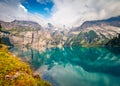 Attractive summer view of unique lake - Oeschinen Oeschinensee, UNESCO World Heritage Site.