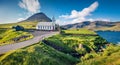 Attractive summer view of Vidareidi Kirkja. Colorful outdoor scene of Vidareidi village, Vidoy island. Bright morning view of Faro