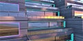 An attractive sunset over the sea is reflected on the panoramic windows of the facade of a stylish, technologically advanced low- Royalty Free Stock Photo