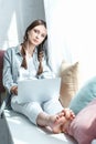 attractive teen girl using laptop and listening music Royalty Free Stock Photo