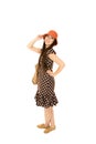 Attractive teen girl wearing polka dot dress orange hat standing Royalty Free Stock Photo
