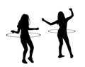 Attractive teen girls couple exercising with a hula hoop vector silhouette illustration isolated on white. Royalty Free Stock Photo