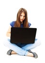 Attractive teenage girl using notebook computer Royalty Free Stock Photo